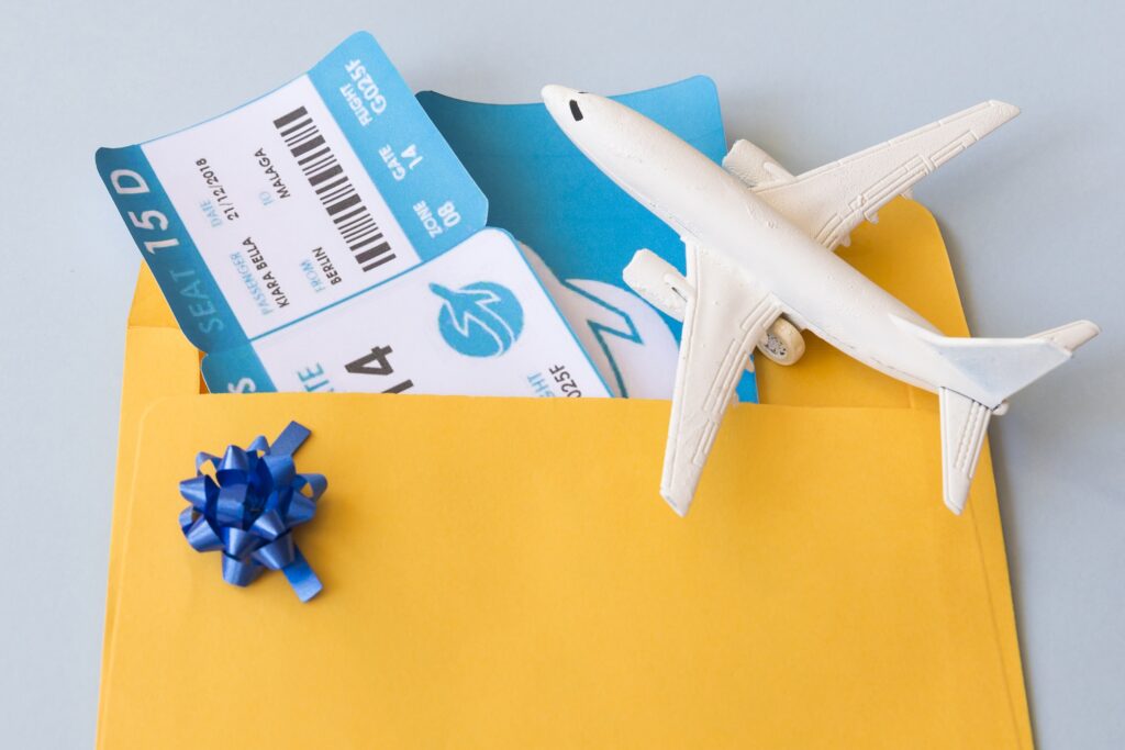 Home 5 airplane tickets document case near toy aircraft min